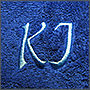 Вышивка на синем полотенце 'KJ'