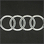 Вышивка на сидениях логотипа Audi на коже