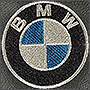 Вышивка логотипа BMW на подголовнике
