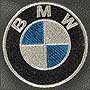 Вышивка логотипа BMW на подголовнике