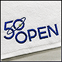 Вышивка на полотенце логотипа 50 open