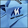 Вышивка на воротнике рубашки логотипа Миг-электро