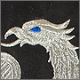 Компьютерная вышивка на ткани серебряного орла